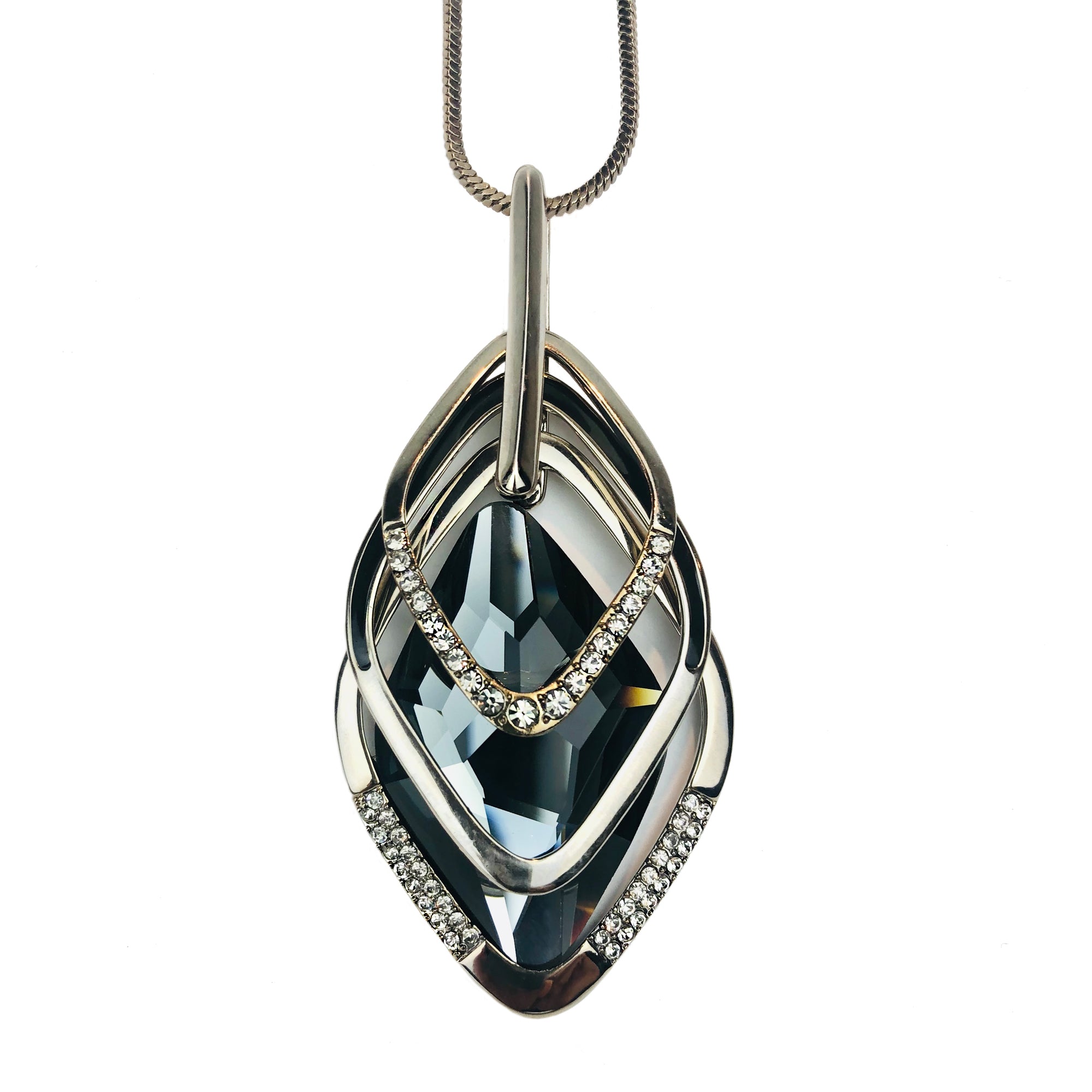 Stunning and elegantly appointed with black featured faceted diamond shaped Crystal Entwined with Cubic Zirconia Gemstones Encrusted Zirconia free floating twin shapes Lobster claw clasp Designer stamp Fixed length 17 1/2" 43.18cm popular and strong 'Box' chain Soft, brown velvet gift bag included