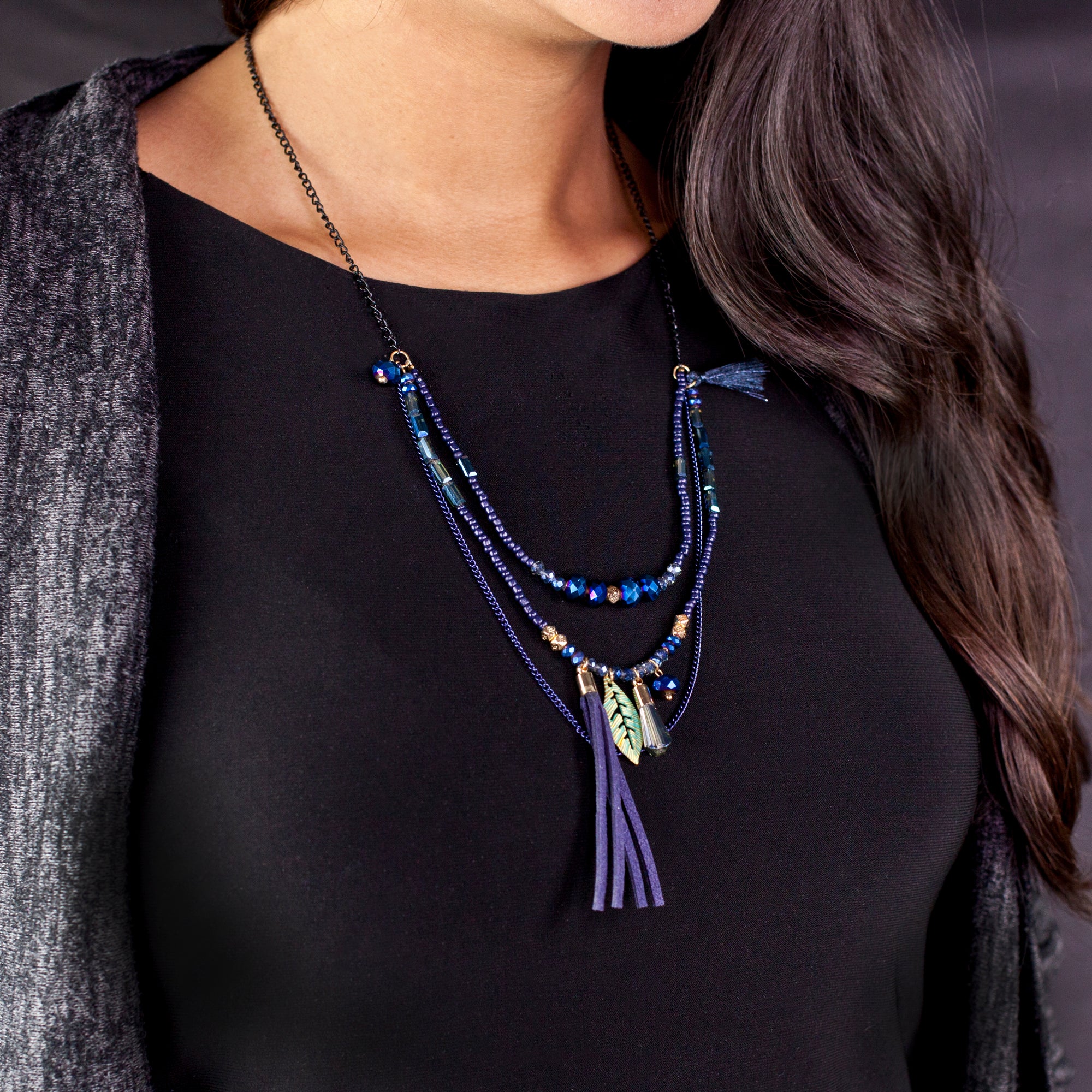 Handmade Totally Boho! Over a hundred of intricately hand strung beads Faceted crystal Black Chain Faux Leather, and raffia tassel Gold Lobster Claw clasp Adjustable length 12”-14, 30.48cm.-35.56cm to bottom of tassel